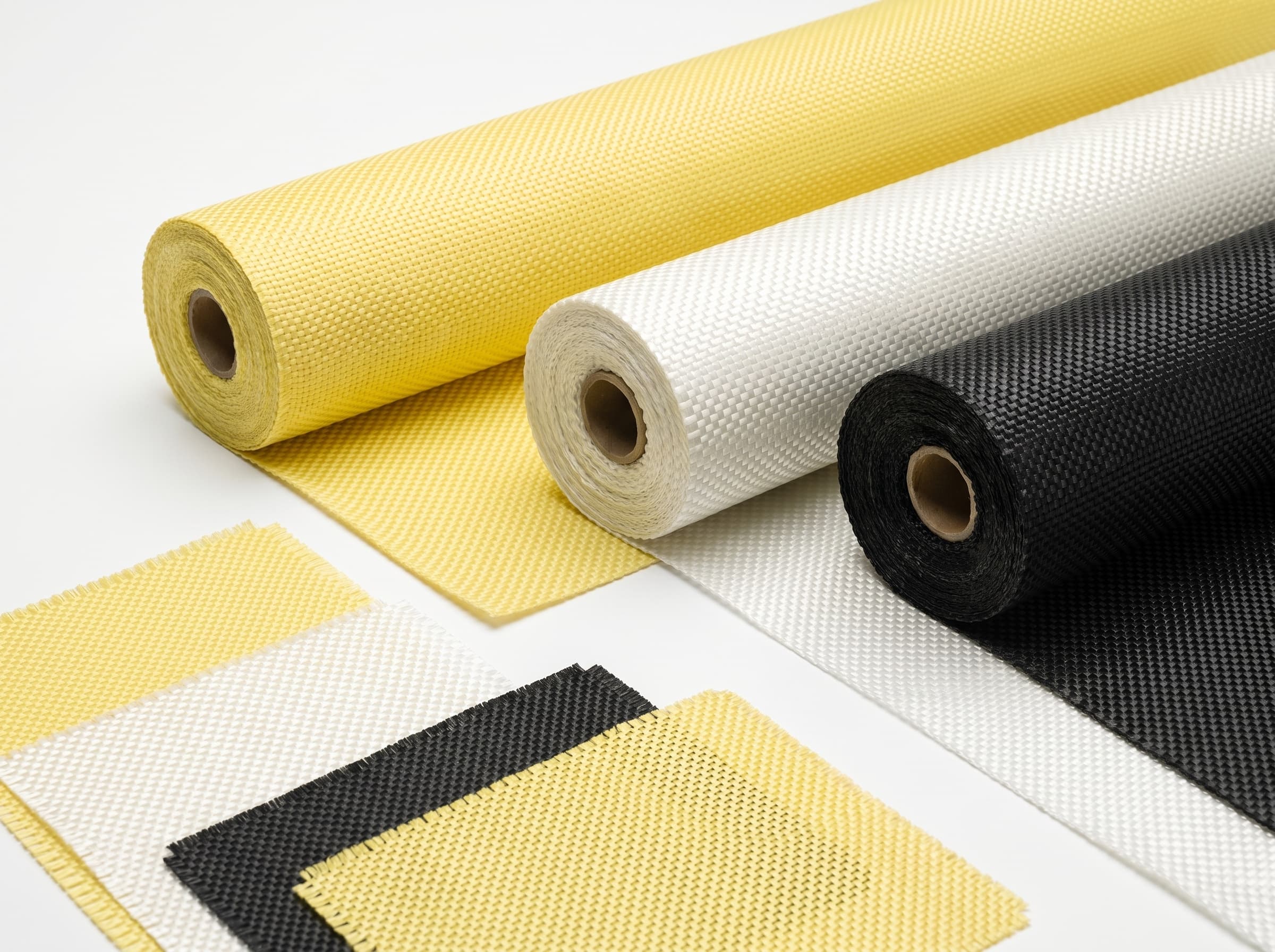 Yellow, white, and black high-performance woven fabric rolls and swatches